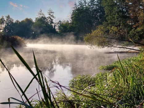Early morning fog over the Müggelspree on a sunny autumn morning