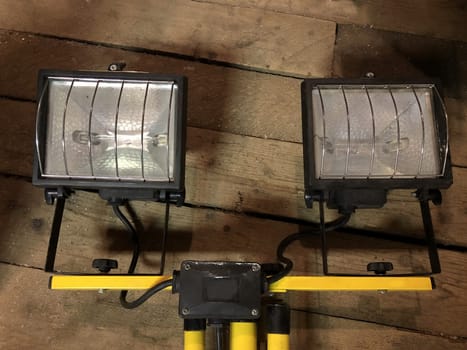 two halogen spotlights in a wooden barn