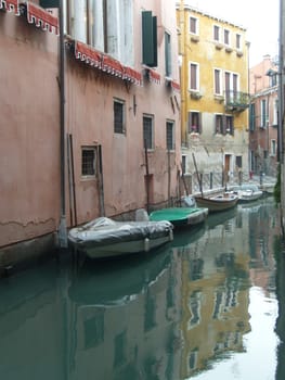 Venice, Italy, 02.22.2007. Venetian streets with graceful building facades. Grand Canal. Along the canal are Gothic and Renaissance palaces. Sights of Italy. Tourism business