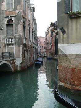 Venice, Italy, 02.22.2007. Venetian streets with graceful building facades. Grand Canal. Along the canal are Gothic and Renaissance palaces. Sights of Italy. Tourism business