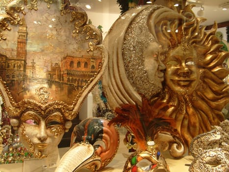 Venice, Italy, September 24, 2020. Venetian masks in a shop window, side view. Beautiful graceful bright carnival masks.