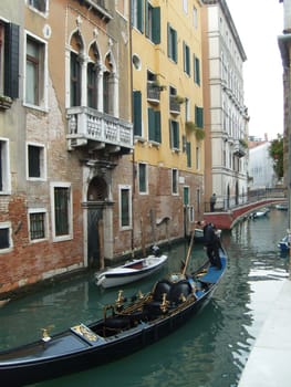 Venice, Italy, 02.22.2007. Venetian streets with graceful building facades. Grand Canal. Along the canal are Gothic and Renaissance palaces. Sights of Italy. Tourism business