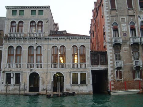 Venice, Italy, July 22, 2007. Venetian streets with graceful building facades. Grand Canal. Along the canal are Gothic and Renaissance palaces. Sights of Italy. Tourism business