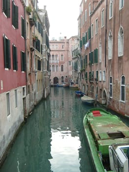 Venice, Italy, 02.22.2007. Venetian streets with graceful building facades. Grand Canal. Along the canal are Gothic and Renaissance palaces. Sights of Italy. Tourism business