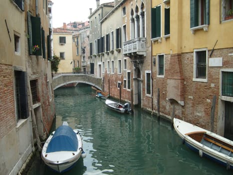 Venice, Italy, 02.22.2007. Venetian streets with graceful building facades. Grand Canal. Along the canal are Gothic and Renaissance palaces. Sights of Italy. Tourism business