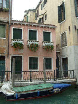 Venice, Italy, 02.22.2007. Venetian streets with graceful building facades. Grand Canal. Along the canal are Gothic and Renaissance palaces. Sights of Italy. Tourism business