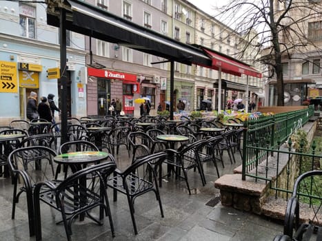Sarajevo, Bosnia and Herzegovina, 8 March 2020, cafe in Sarajevo. Streets and sights, tables and chairs await guests. Rainy weather. Early opening of the tourist season.