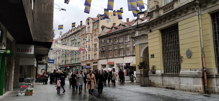 Sarajevo, Bosnia and Herzegovina, March 8, 2020. People on the streets of Sarajevo. Tourists and locals walk around the city center, visit shops, cafes. Historic Center of Sarajevo with Attractions.