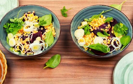Salad with beets, red lentils, onions and herbs. Clean eating.