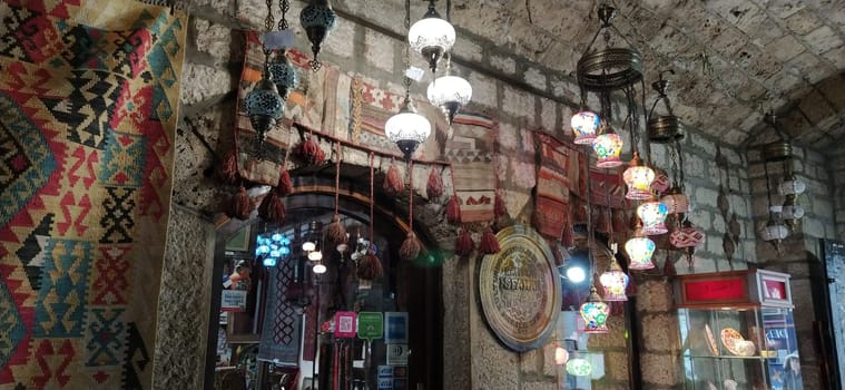Traditional vintage Turkish lamps over light background in the night. Colored glass lamps and shades on the market in Sarajevo, Bosnia and Herzegovina. Sale of souvenirs in the market