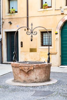 Verona, Italy - July 2022: the famous Well of Love, romantic sightseeing in the heart of the city