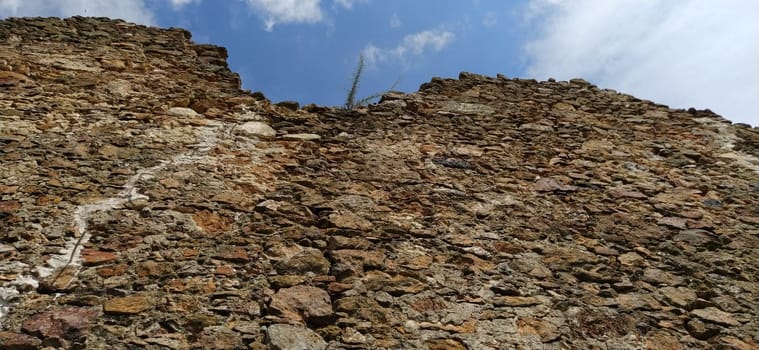 The walls of the old tower. Stone masonry that has stood in the open air for centuries. Sights of Serbia. Kula