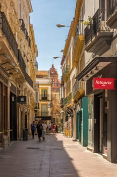 small street in the old town of Seville, Andalusia, Spain