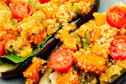 Baked eggplant stuffed with pumpkin and quinoa. Vegetarian food recipe