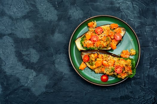 Baked eggplant stuffed with pumpkin and quinoa. Vegetarian food recipe