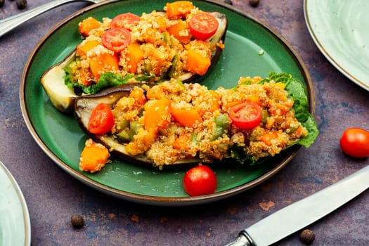 Baked eggplant stuffed with pumpkin and quinoa. Vegetarian food recipe