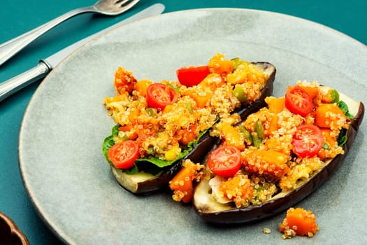 Baked eggplant stuffed with pumpkin and quinoa. Vegetarian food recipe