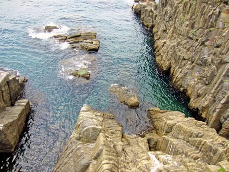 Rocky shore in Riomaggiore on Italian coast