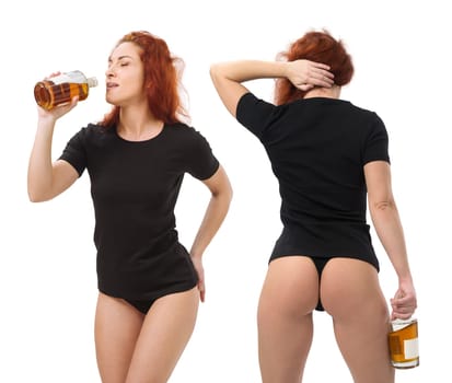 Photo of a young beautiful redhead woman with blank black shirt and black underwear, drinking whisky from a bottle. Isolated over white background and ready for your design or artwork.