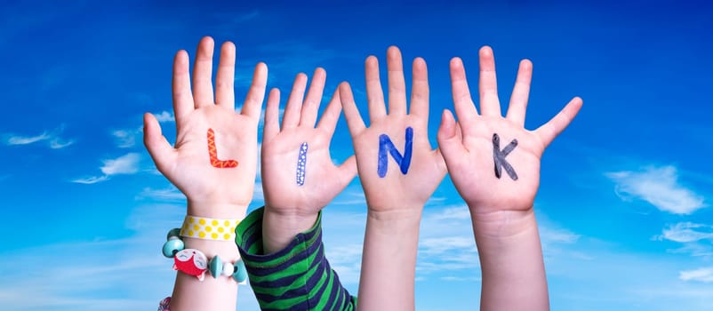 Children Hands Building Colorful English Word Link. Blue Sky As Background