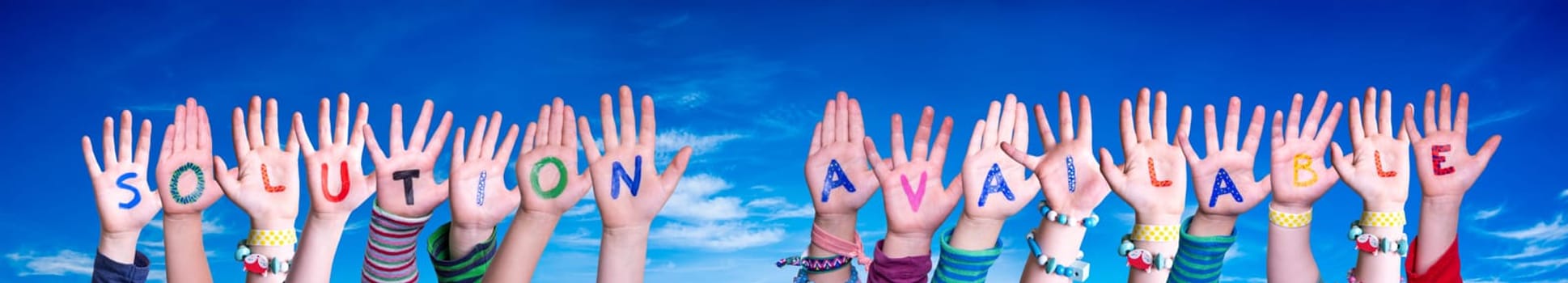 Children Hands Building Colorful English Word Solution Available. Blue Sky As Background
