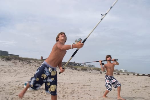 Two brothers fishing at Long Beach Island in New Jersey.