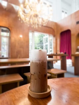 Iced matcha greentea on wooden table in coffee shop, stock photo