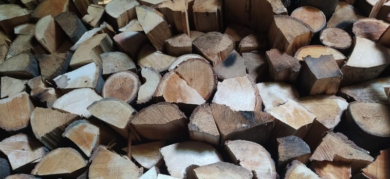 Pile of firewood. Firewood stacked in a woodshed.