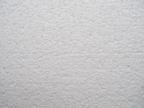 Polystyrene foam texture. White styrofoam. Styrofoam slice as background