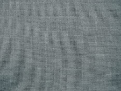 Texture canvas fabric as background. Gray sackcloth. Grey linen scrim.