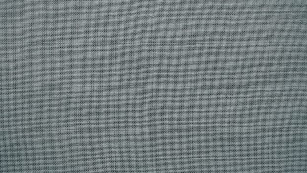 Texture canvas fabric as background. Gray sackcloth. Grey linen scrim.