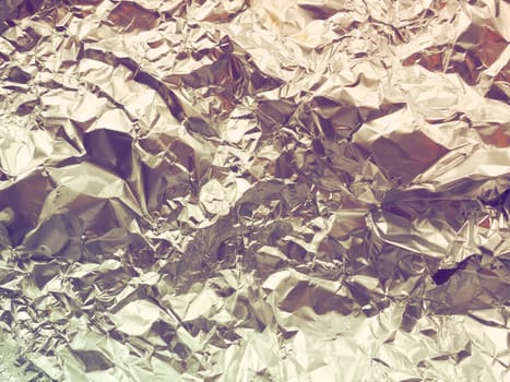 foil close-up. Aluminum gold crumpled foil. Abstract metallic background. Foil for baking food. Background. Retro or vintage style.