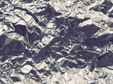 foil close-up. Aluminum silver crumpled foil. Abstract metallic background. Foil for baking food. Background.