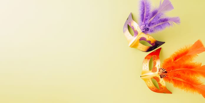 Happy Purim carnival accessories. Top view carnival mask for Mardi Gras celebration isolated on pastel green background, jewish holiday, Purim in Hebrew holiday