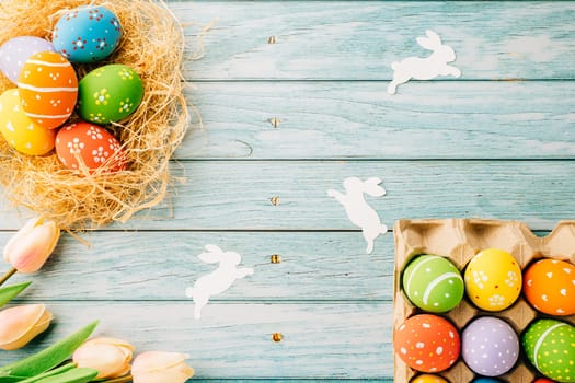 Top view holiday banner background web design white easter eggs in brown nest on blue wooden background with empty copy space, celebration greeting card, overhead, template, Happy Easter Day Concept