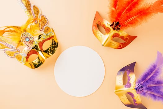 Happy Purim carnival decoration. Top view venetian ball mask with feather on pastel background white paper circle, Masquerade party, Jewish Purim in Hebrew, holiday background banner design