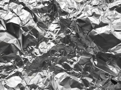 foil close-up. Aluminum silver crumpled foil. Abstract metallic background. Foil for baking food. Background.
