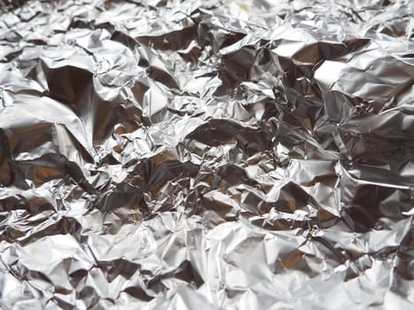 foil close-up. Aluminum silver crumpled foil. Abstract metallic background. Foil for baking food. Background.