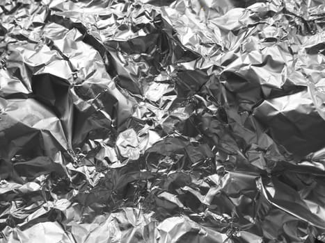 foil close-up. Aluminum silver crumpled foil. Abstract metallic background. Foil for baking food. Background.