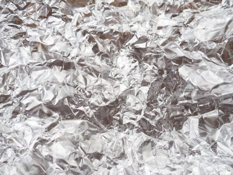 foil close-up. Aluminum silver crumpled foil. Abstract metallic background. Foil for baking food. Background.
