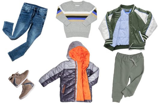 Collage set of boys spring winter clothes isolated. Male kids apparel collection. Child boy fashion clothing outfit. Colorful stylish jeans, sweater, pants, jackets, boots wearing.