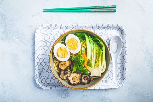Ramen soup with shiitake mushrooms, vegetables, noodles and egg