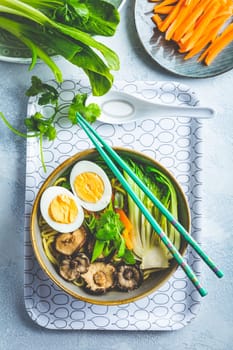 Ramen soup with shiitake mushrooms, vegetables, noodles and egg