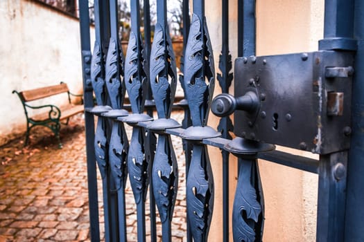 Detail of forged old iron gate - selective focus