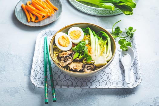 Ramen soup with shiitake mushrooms, vegetables, noodles and egg