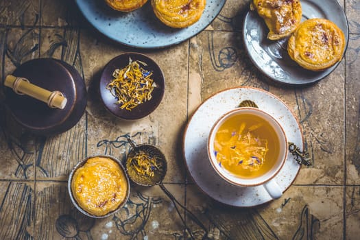 Pastel de nata with cup of herbal tea, Portugal sweet egg and pudding pastry