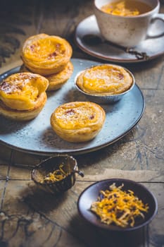 Pastel de nata with cup of herbal tea, Portugal sweet egg and pudding pastry