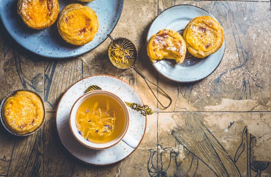 Pastel de nata with cup of herbal tea, Portugal sweet egg and pudding pastry