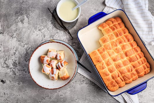 Buchteln, sweet rolls made of yeast dough with milk and butter, served with vanilla sauce. Traditional meatless dish in Europe