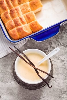Buchteln, sweet rolls made of yeast dough with milk and butter, served with vanilla sauce. Traditional meatless dish in Europe